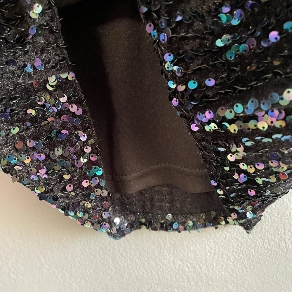 Molly Bracken multi color sequins black mini skirt. Size XS.